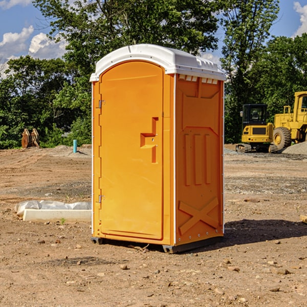 what is the cost difference between standard and deluxe portable restroom rentals in Dickinson County KS